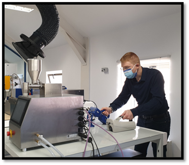 Man in mask working in laboratory.